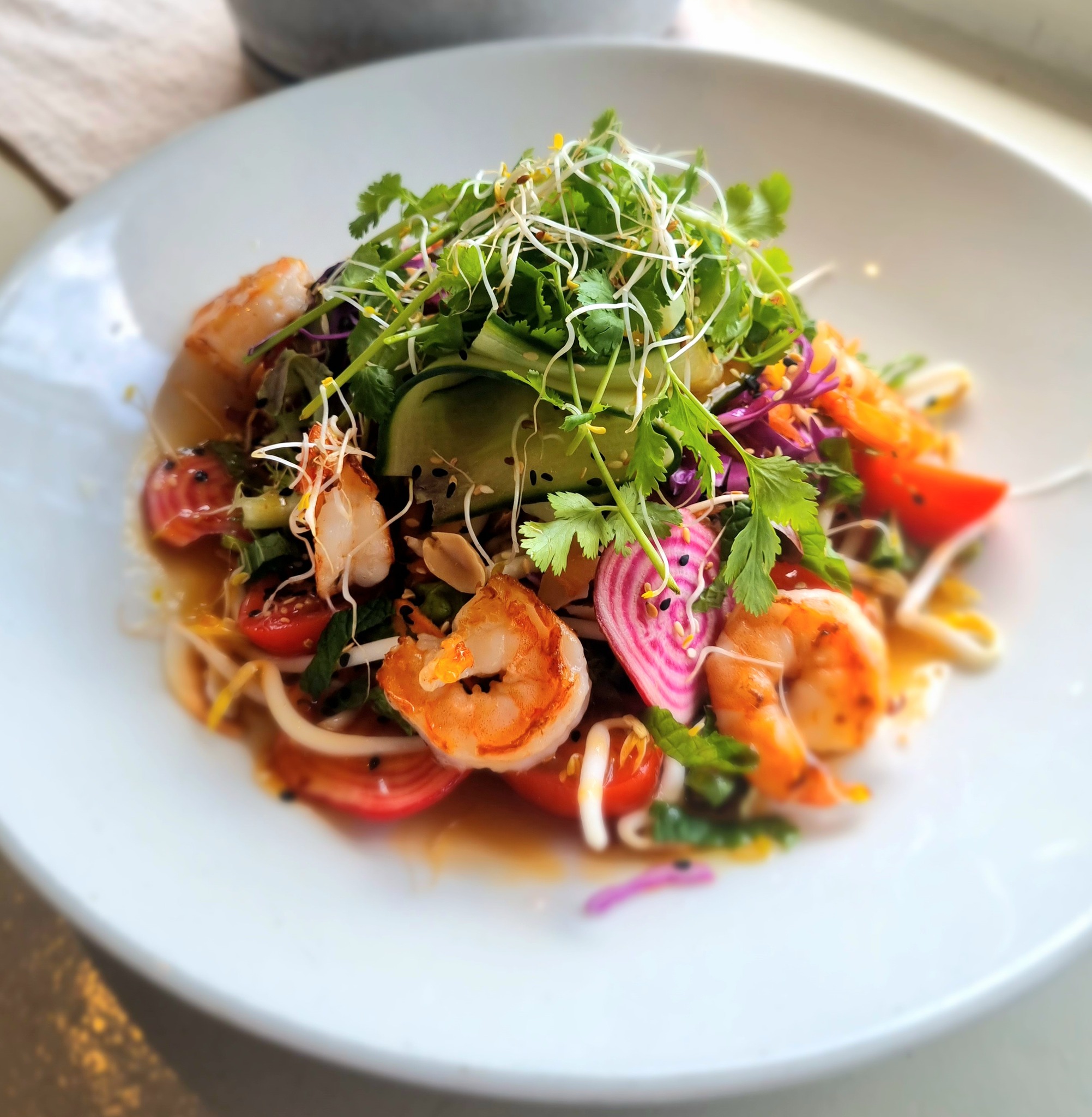 Prawn salad with colourful vegetables and fresh herbs