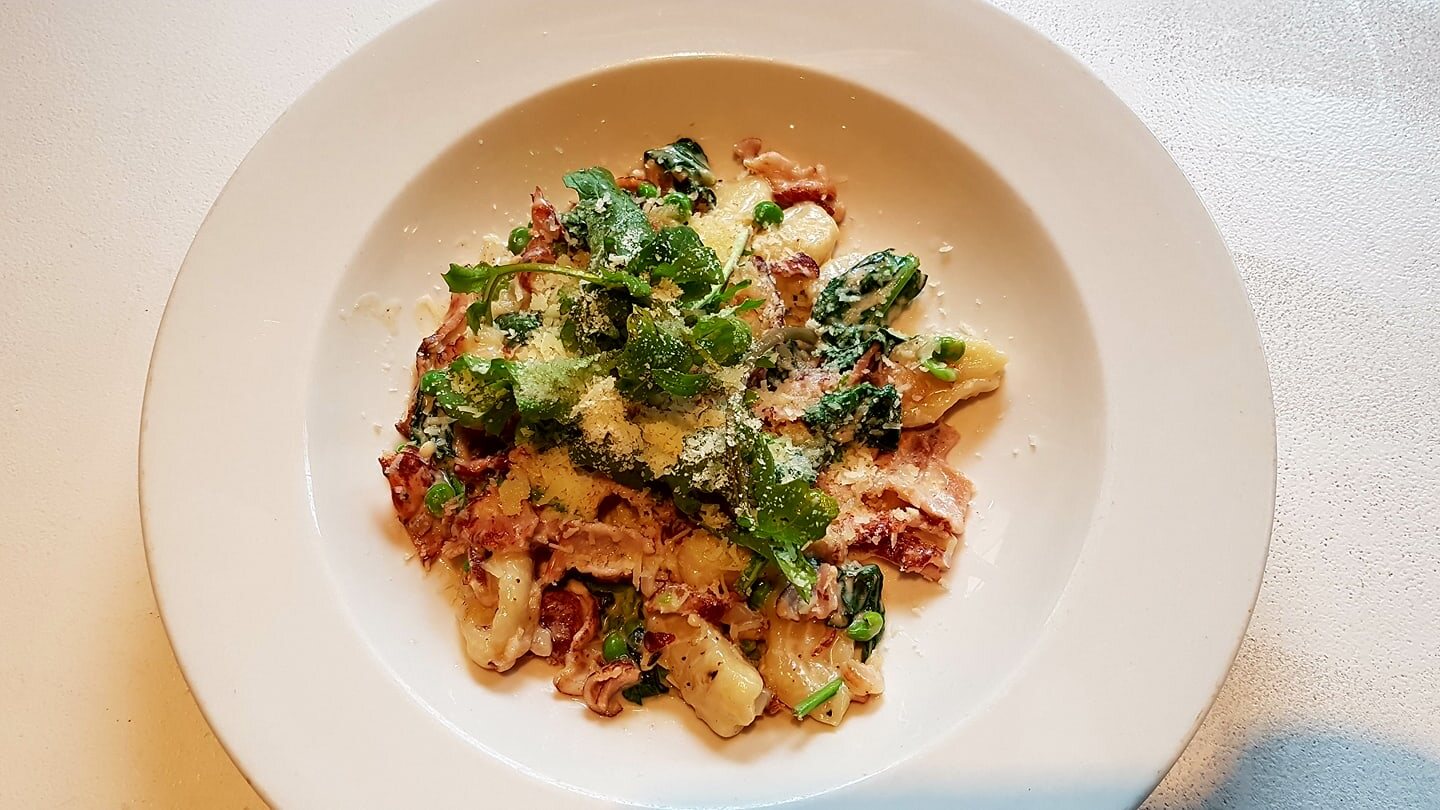 Bacon and pea gnocchi finished with herbs