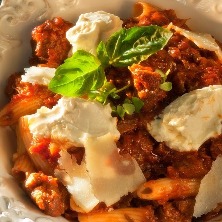 Lamb ragu with crème fraîche and fresh basil