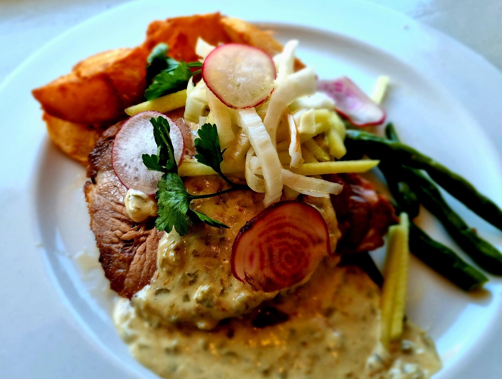 Pork neck with vegetables and a creamy mustard sauce