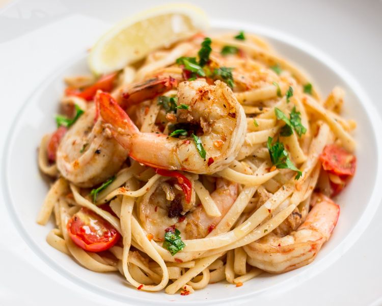 Prawn pasta with cherry tomatoes and herbs
